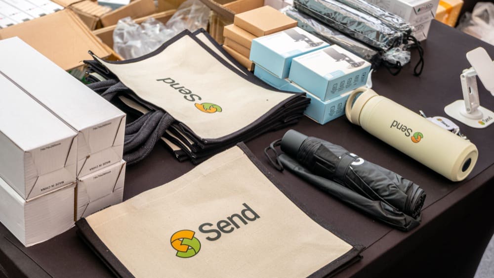 Send merchandise — tote bags, umbrella, bottle and boxes
